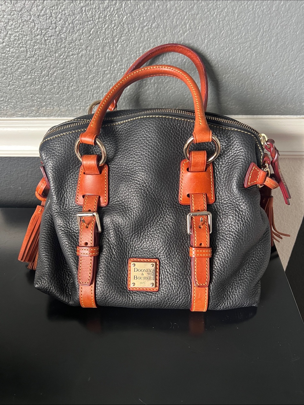 Dooney & Bourke Black Pebbled Leather Satchel with Brown Trim